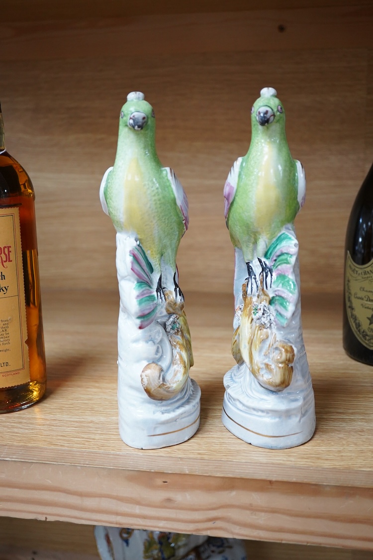 A pair of early 19th century pearlware parrots, ex John Howard, 24cm high